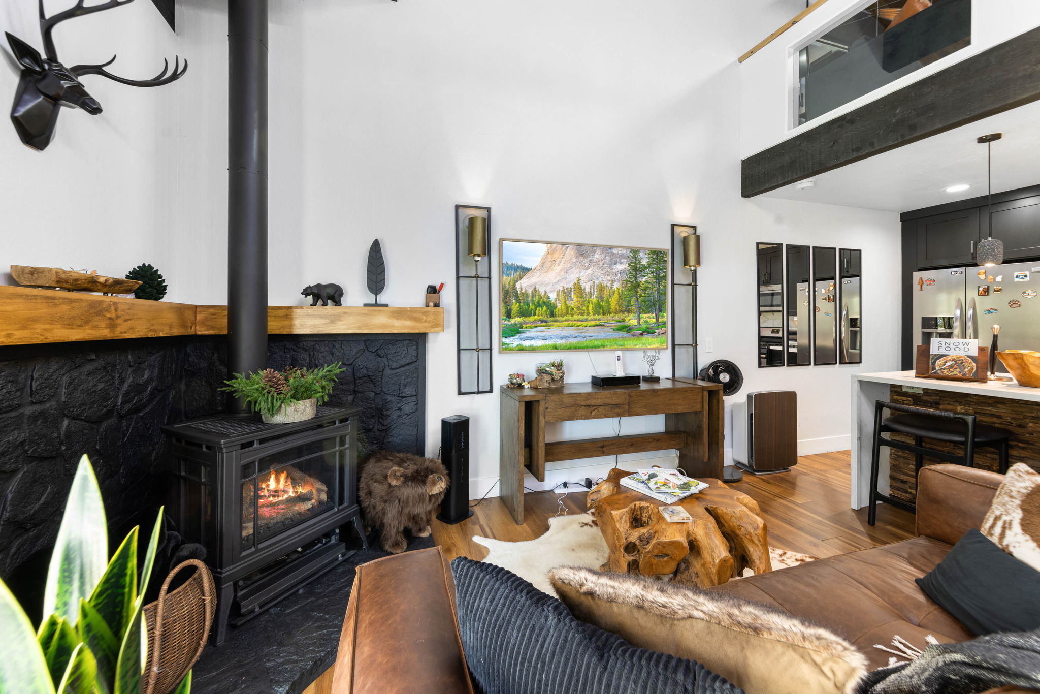 Cubs Manor: blackened stone hearth and timber mantel