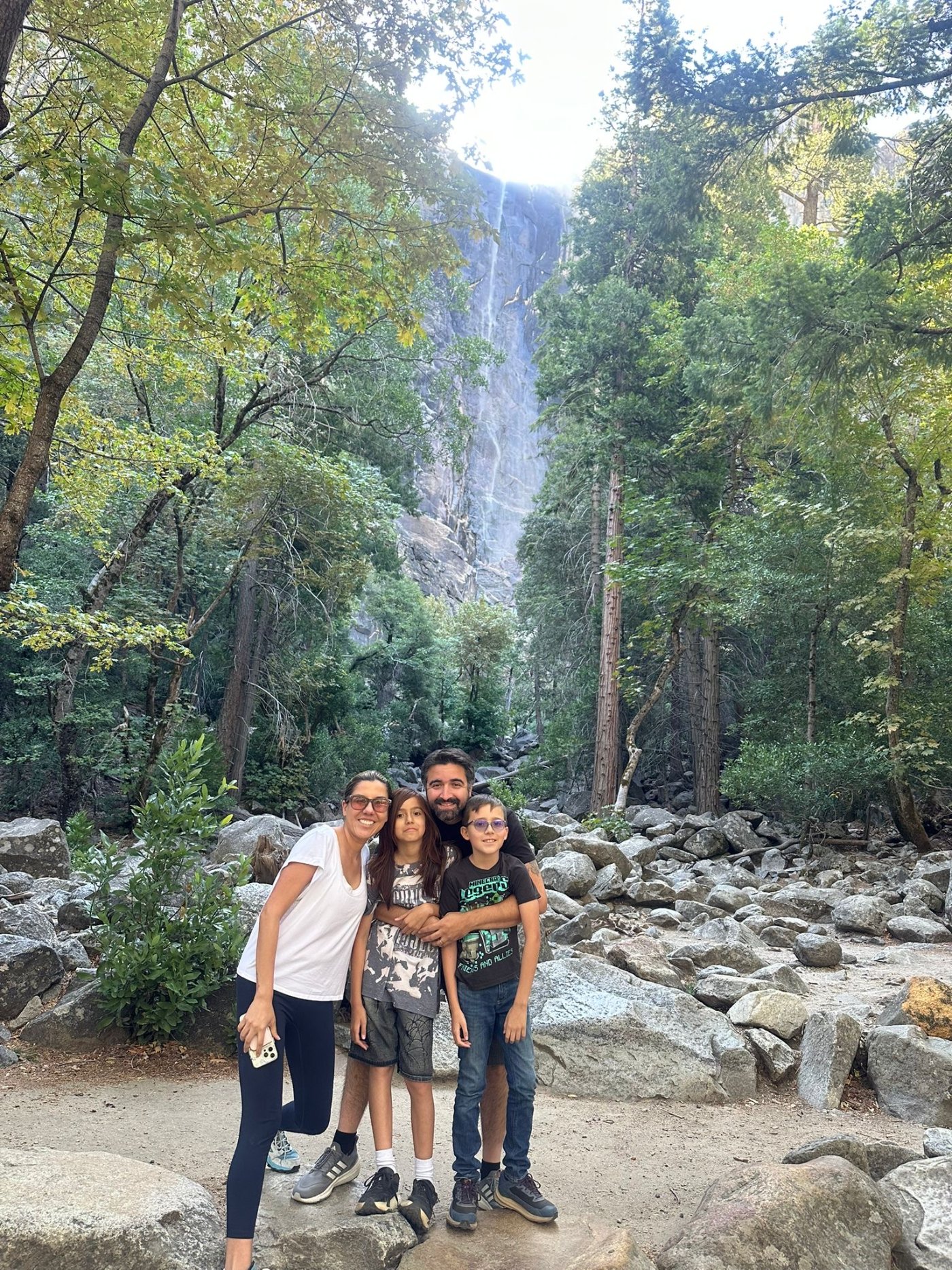 Meisy Ortega with her family below a waterfall in Yosemite