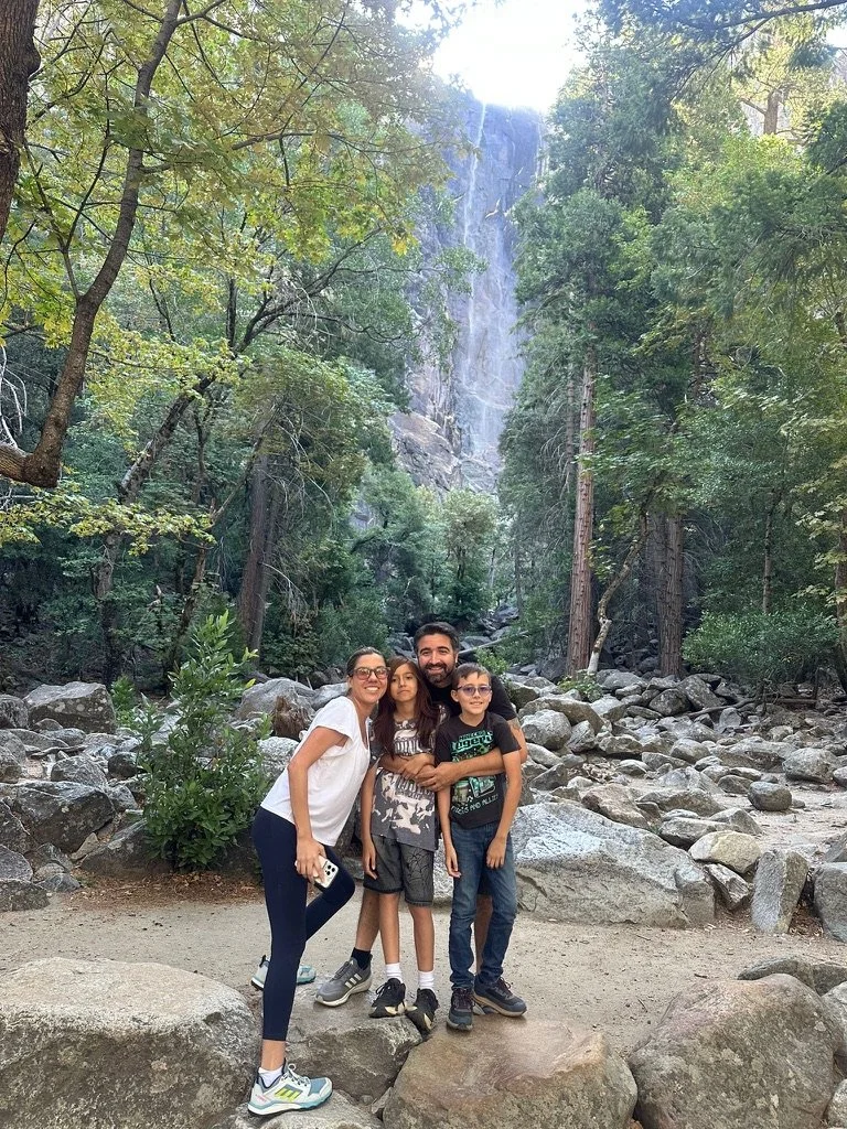 Meisy Ortega with her family outdoors in the mountains